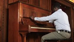 Man opening piano Stock Footage