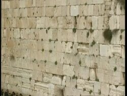 MWA Wailing wall, tilt down to reveal devout Jews praying, Jerusalem Stock Footage