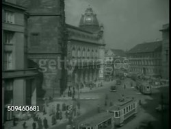 1938: PRAGUE, CZECHOSLOVAKIA: XHA WS Cityscape w/ trams moving on street, Municipal House (Art Nouveau) building & dome (C)in Old Town. (Czech Republic) Instructional Video