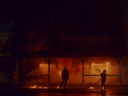 WS Firemen working on blazing structure fire / Unspecified Stock Footage