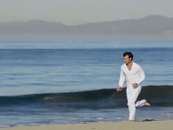  MS TS PAN Man running on beach / Redondo Beach, California, United States Stock Footage