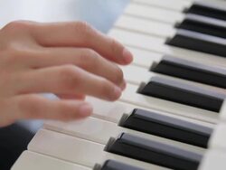 HD : Mother playing a piano with her baby Stock Footage