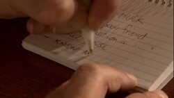 A criminal investigator jots down notes. Stock Footage