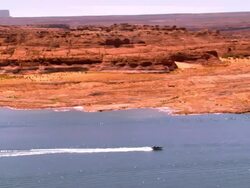 WS PAN across Lake Powell in Glen Canyon National Recreation Area with speed boats and house boats on the lake / Page, Arizona, USA Stock Footage
