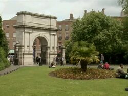 MS PAN View of fusilier's arch and students / Dublin, County Dublin, Ireland Stock Footage