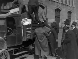 B/W 1900s immigrant men loading truck with luggage / NYC / newsreel Stock Footage