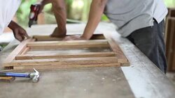 Carpenter used air gun on woodwork Stock Footage
