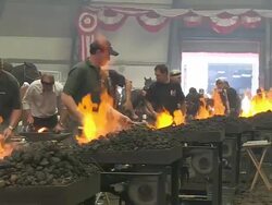 MS Shot of participators playing in blacksmith competition at Calgary Stampede / Calgary, Alberta, Canada Stock Footage