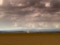 WS View of storm in desert with grey sky and truck / Djibouti Stock Footage