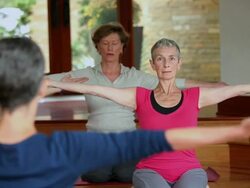 MS PAN Teacher demonstrating yoga poses to class in studio / Richmond, Virginia, United States Stock Footage