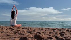 Yoga at the beach Stock Footage