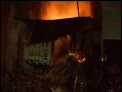 Flames lit up the night sky over Haiti''s capital on Friday as a number of buildings were on fire in the commercial district. News Clip