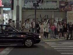 PAN Pedestrians at crosswalk in Shinjuku, Tokyo, Japan. Stock Footage