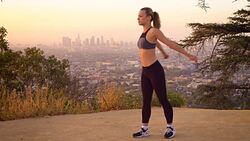 Athletic Woman Stretching Stock Footage