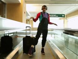 MS Shot of young man dancing with bag on escalator in urban area / Minneapolis, Minnesota, United States Stock Footage