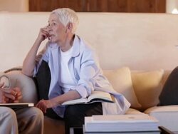 Senior couple talking in the living room Stock Footage