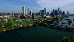 Aerial View Austin Texas Skyline Colorado River Fun Spring water activities Pan Right looking at entire city skyline of Austin TX Stock Footage