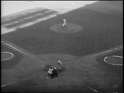 B/W 1956 high angle Don Larsen pitching a 'perfect game' with Dale Mitchell batting + striking out / Game 5 of the World Series / NYC Stock Footage