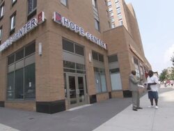 WS Two men conversing outside of  Hope Center on sidewalk AUDIO  / New York City, New York, United States Stock Footage