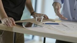 MS Two young businessmen working together on business project in modern office Stock Footage