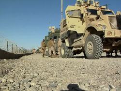 February 2009 WS Soldiers with armored vehicle / Kabul, Afghanistan Stock Footage