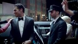 Chauffeur opens limousine door, celebrity couple walk red carpet and wave to fans at awards show Stock Footage