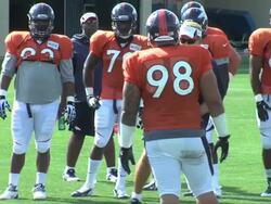 Denver Broncos defense at training camp Stock Footage