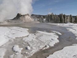 MS TU Geyser erupting in snowy landscape / Yellowstone National Park, Wyoming, United  Stock Footage