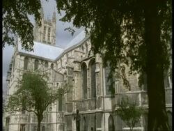 Canterbury Cathedral, Kent - trees in foreground, windy Stock Footage