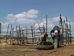 MS Shot of People searching for water at shaft / Pilao Arcado, Bahia, Brazil Stock Footage
