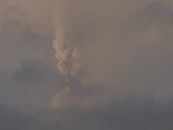 Erupting volcano shoots ash high into the sky in evening light, Philippines, Dec 2009 Stock Footage