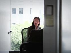 MS PAN mature businesswoman and businessman in discussion in conference room/Seattle, Washington, USA Stock Footage