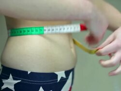 Woman's body, measuring waist .. Stock Footage