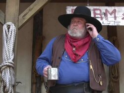 Cowboy with a mobile phone. Stock Footage