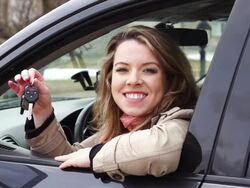 Young smiling woman with key Stock Footage