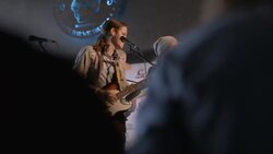 Lively crowd dance and sing along to rock band performing in Austin bar Stock Footage