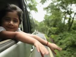 Girl watching from window of a car, Malshej Ghat, Maharashtra, India Stock Footage