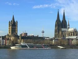 WS View of Rhine river with church Gross St. Martin and Dom (Cathedral) / Cologne, North Rhine Westphalia, Germany Stock Footage