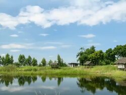 Hut lakeside and clouds moving Stock Footage