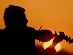 Musician At Sunset Stock Footage