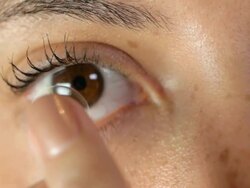 contact lens applied to eye Stock Footage