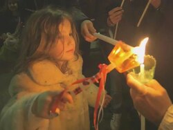 MS Ligthing candles in group on easter celebration at night AUDIO / Kerkyra, Corfu, Greece Stock Footage