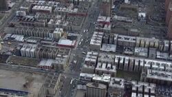Aerial view of Harlem, NYC: streets and rooftops at Adam Clayton Powell Jr Boulevard. Stock Footage