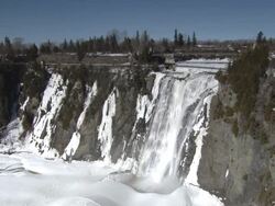 WS View of Montmorency Falls and Suspension Bridge / Quebec, Canada Stock Footage
