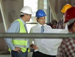 HD DOLLY: Construction Team Examining The Blueprints Stock Footage