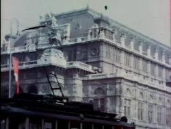 1930s long shot busy street w/traffic, cafes, red swastika flags / Vienna, Austria Stock Footage