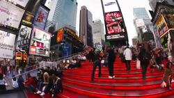 Tourists gather on bleachers on 42nd Street in Times Square. Stock Footage