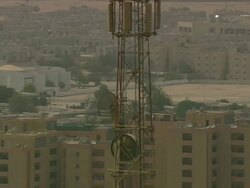 WS AERIAL ZI Shot of mobile tower in city / Qatar Stock Footage