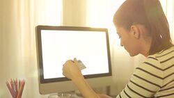 Attractive woman buying online with her credit card using the computer. Stock Footage