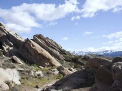  WS T/L PAN People hiking at Vasquez rocks with mountains in background / Agua Dulce, California, USA Stock Footage